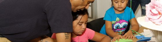 Volunteer assists kids at Hands-on Houston