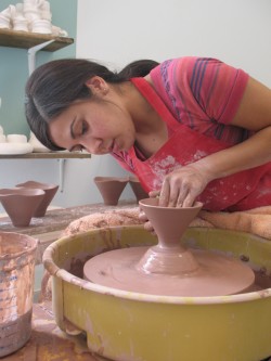 Resident artist Jamie Diaz works with clay