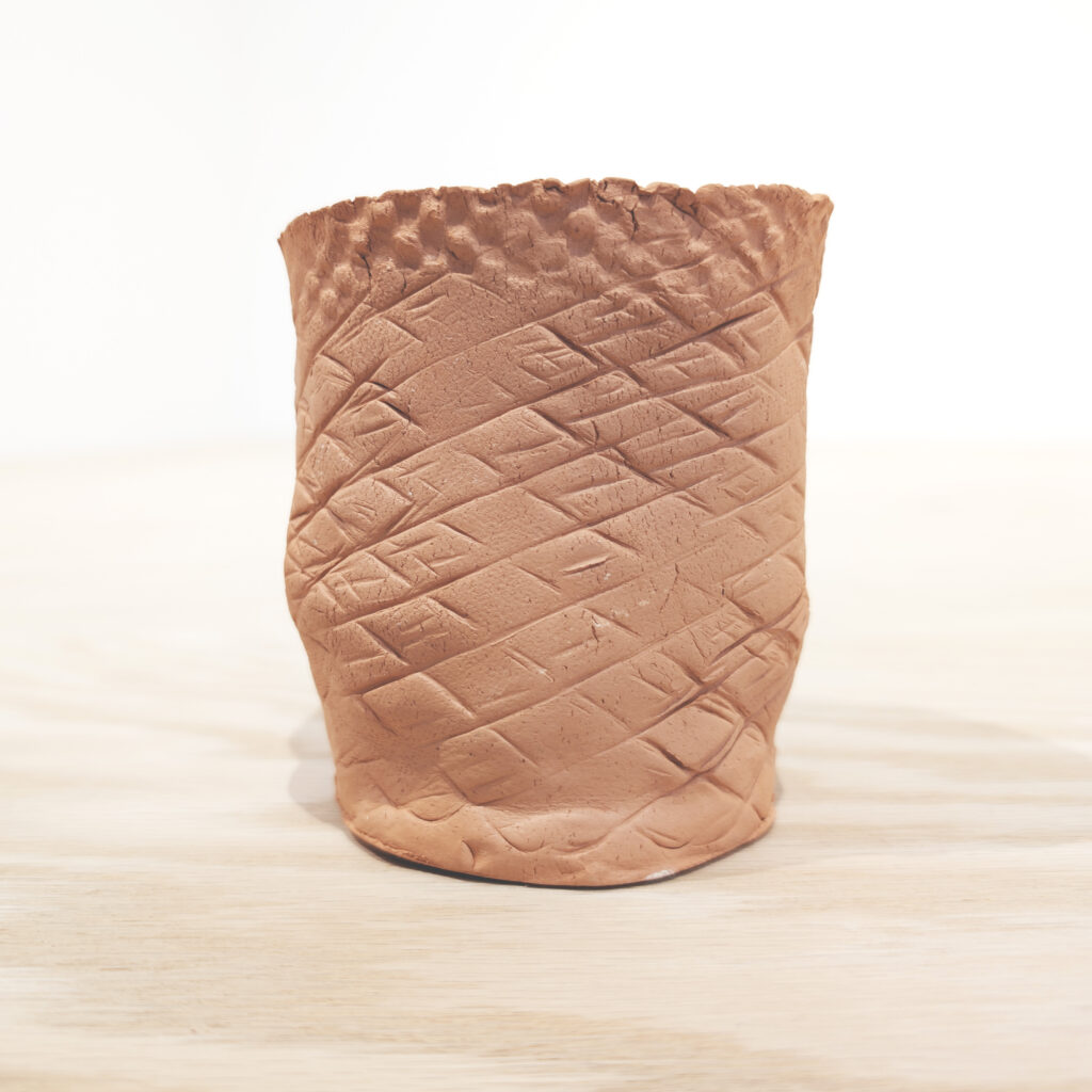 an image of a sample clay mug from a previous workshop.